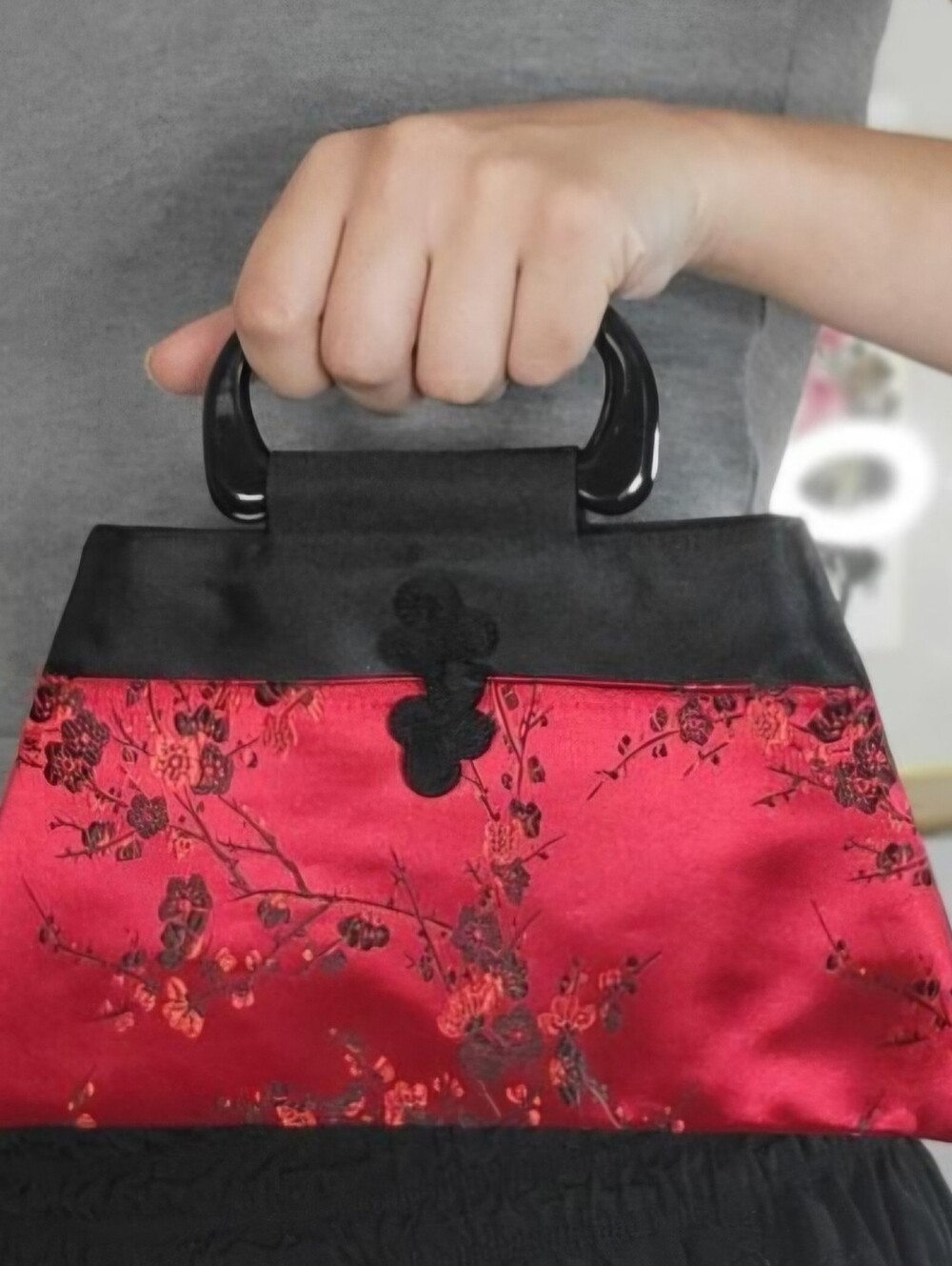 Vintage-style Asian satin handbag features a distinctive cherry blossom floral